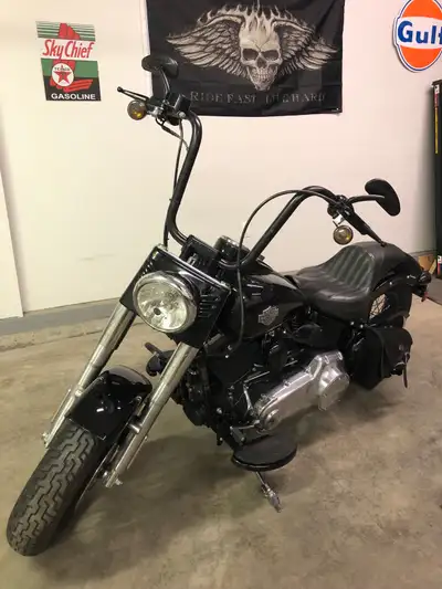 2013 Harley Davidson Softail Slim in excellent condition. Vance and Hines short shot pipes, 14” ape...