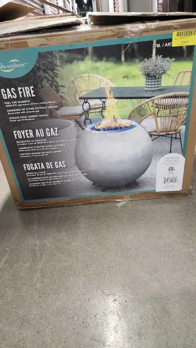 Brighten up your backyard with this Ella Outdoor gas fire pit. This spherical fire pit features a cl...