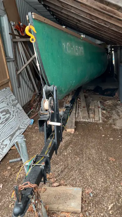 Faber canoe with trailer and 20 hp Mercury outboard for sale, View more
