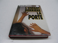Livre L'Enfant Derrière La Porte (L42-21) - 5$