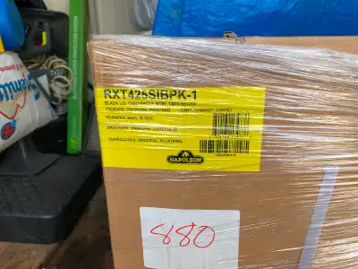 Napoleon Rogue 425 BBQ three burner with infrared side burner. Still in box new. Black lid. cash. Ca...