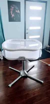 Baby cot with multiple settings for sale.