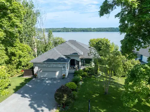 Custom Waterfront bungalow style home meticulously planned and built in 2017. with approx. 2740 Sq F...