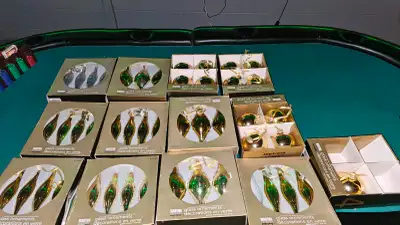Martha Stewart vintage glass Christmas tree ornaments. They are all gold. The green is just from lig...
