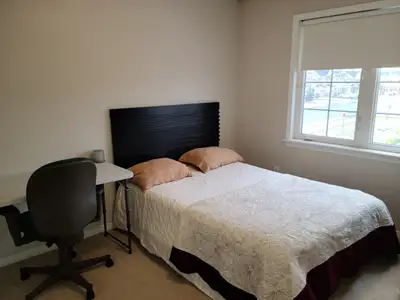 One bedroom with a double size bed in a beautiful townhouse located in Kanata, shared bath room, all...