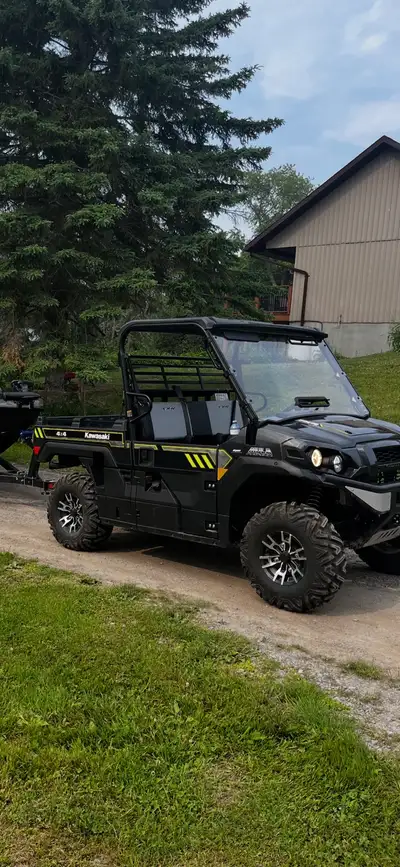 I'm selling my used Kawasaki Mule, a robust side-by-side, perfect for work or play, showing 414 kilo...