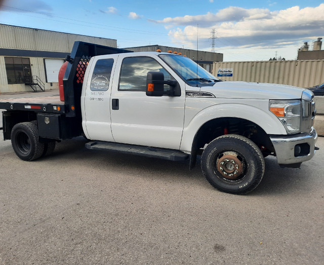 2012 F350 Dually ext cab Flat Deck (RETIREMENT SALE) in Cars & Trucks in Calgary - Image 2