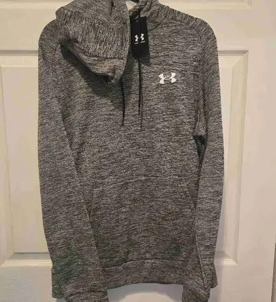 This brand new Under Armour hoodie features a stylish grey marl pattern and the iconic Under Armour...
