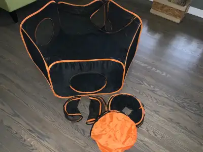 Playpen for cat or dogs. Has 2 attachable tunnels, carrying case and 2 side zippered circles to full...