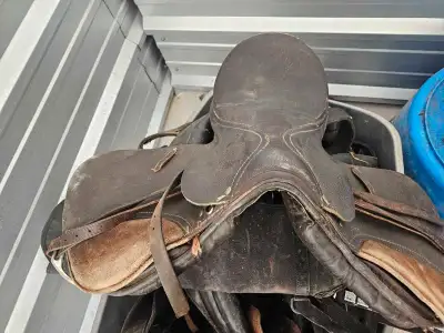 I'm selling a used English riding saddle, perfect for riders looking for a reliable and functional s...