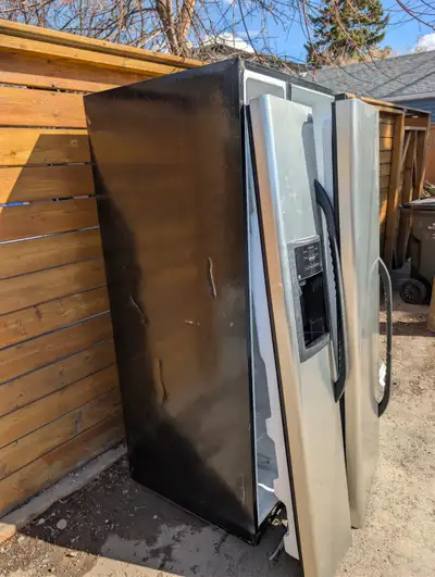 Free Fridge Freezer. Stopped working.  Doors are off hinges, View more