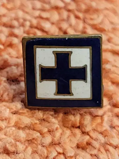 This pin has great enamel and colors. Mid century construction. With backing . A nice clean example.
