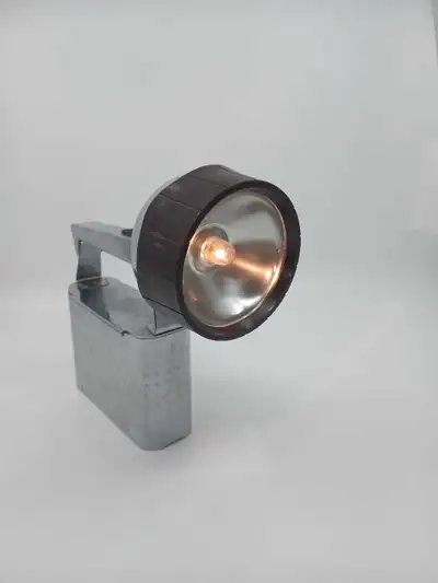 Vintage Burgess Radar-Mate flashlight, a classic piece of lighting technology. The flashlight featur...