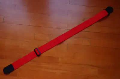 LEVY'S RED GUITAR STRAP, 5 CM WIDE X 160 CM LONG EXCELLENT COND., View more