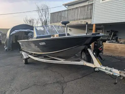 Full windshield with walk through. Bimini top and boat cover. New jack, winch, tongue coupler, and t...
