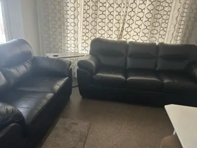 Two Black Leather sofas, View more