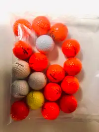 A bag of 18 golf balls of various brands