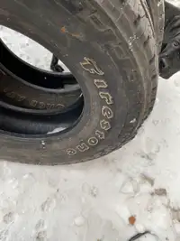 Two Firestone Winterforce 245/70R17 tires 