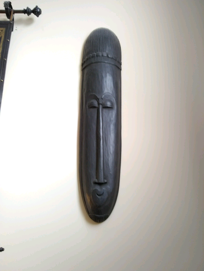 Beautiful tribal wall mask. 8"W x 36"H. There are 2 available, but will sell individually.