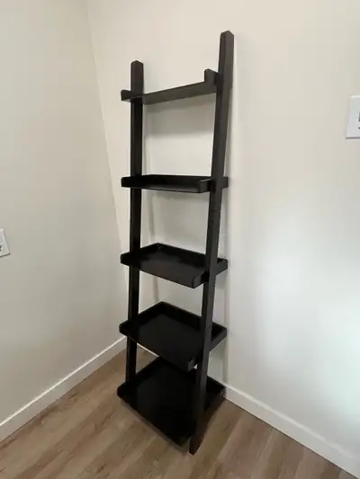 Enhance your home decor with this stylish dark brown ladder shelf, perfect for adding a touch of mod...
