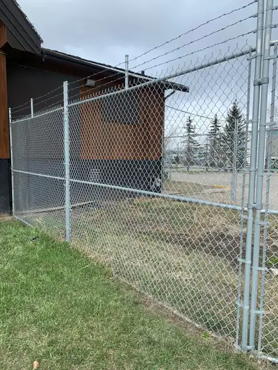 Chainlink Security Fencing panels with barb wire tops these panels hold together with 1 -7/8” panel...