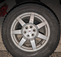 Four Studded Winter Tires on Cadillac Rims - Hankook 235/65-R17