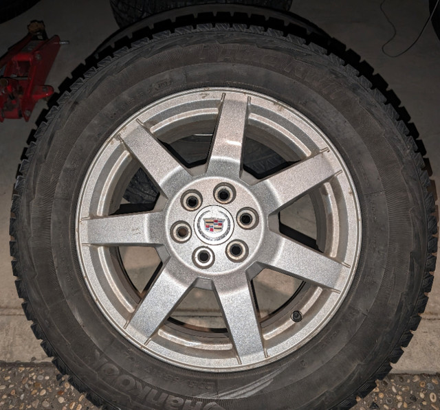 Four Studded Winter Tires on Cadillac Rims - Hankook 235/65-R17 in Tires & Rims in Strathcona County