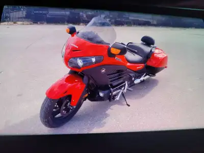 2014 Honda Goldwing f6. Red in color. 13000 kms. Original owner. After market tinted windshield. Thr...