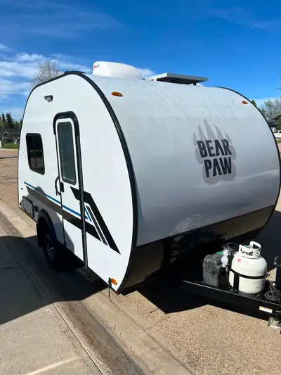 SUV towable trailer. Table folds into a king size bed. Has all the necessary camping needs — fridge,...