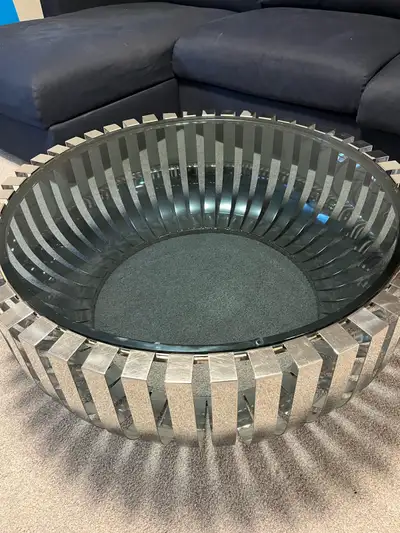 Very sturdy modern glass coffee table. Paid over $900 when new. Diameter is 39” and height 14”. Sell...