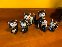 6 Vintage Anthropomorphic Japan Ceramic Skunks Figurines. These