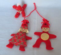 Three red handmade Christmas decoration figures