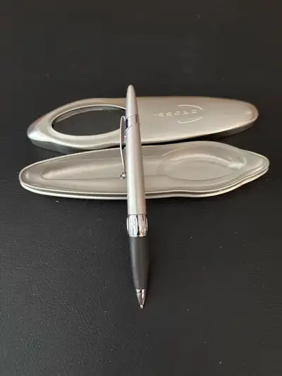 This is a stylish used Cross Pen with its original case. It's perfect for everyday use or as a sophi...