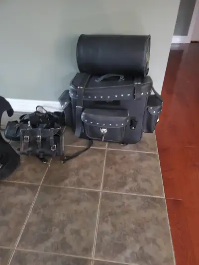 Bags for a motorcycle. has a roll top on top. In excellent condition. Also have a tool pouch for the...