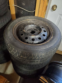 195/60R15 Firestone Champion Tires on Rims