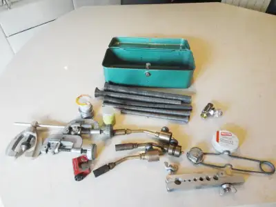 Selling a metal carry case of Various Plumbers Tools that include Brass Torch Tips, Pipe Cutters, Fl...