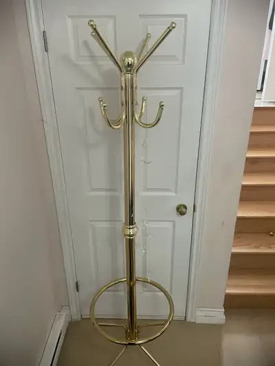 I am selling a used golden standing coat rack. This stylish and functional coat rack is perfect for...
