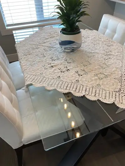 Excellent Condition, beautiful Glass Table with 4 Leather Chairs. Chairs were re-covered 2 years ago...