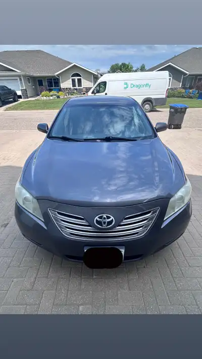 Hello there! We’re selling our 2008 Toyota Camry Hybrid in grey. It has 285,000 kilometres on the od...