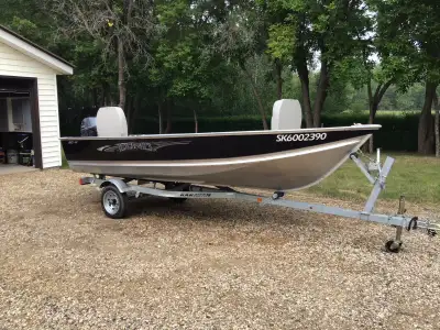 LIKE NEW 2018 14 ft. Lund boat with 20 HP Yamaha…. With all accessories……ONE OWNER….. Used four time...