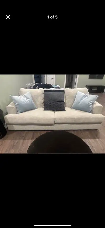 Purchased from Ashley furniture one year ago. Hardly been used. Comes with throw pillows