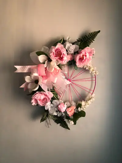 Enhance your space with the timeless elegance of this White Magnolia and Pink Peony Wreath displayed...
