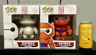I'm offering two Funko Pop figurines of Baymax from Big Hero 6, numbered 111 and 112. These collecti...