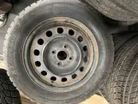 4 used winter claw tires on rims