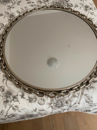 Gorgeous large silver mirror with a decorative chain around it