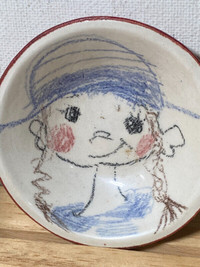 Girl mini pottery face plate.