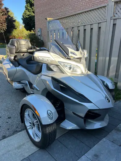 Get ready to turn heads with this sleek, silver 2010 Can-Am Spyder RT! This eye-catching roadster is...