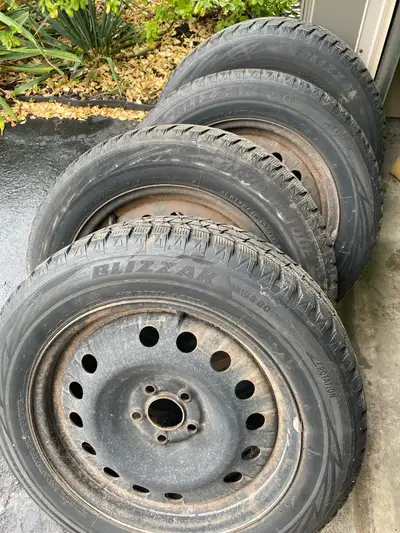 4 used blizzak winter tires on steel rims. 5 bolt pattern off of a 2017 ford escape. Will fit other...