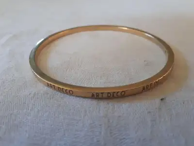 This beautiful bracelet is engraved 'Art Deco'. It is made by Roberto Coin Co. You can go to their w...