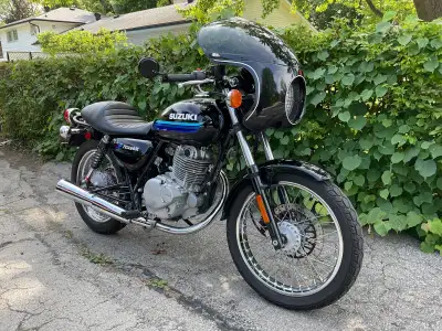 Suzuki 250 in cafe racer trim. Fibreglass fairing, model specific seat imported from Japan. Lowered...